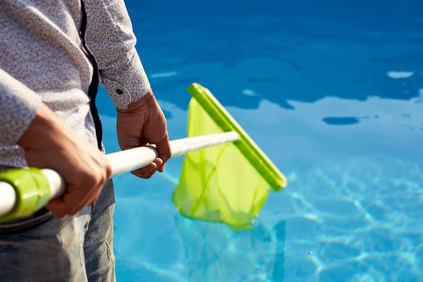Composite deck wrapping a rectangular in-ground pool